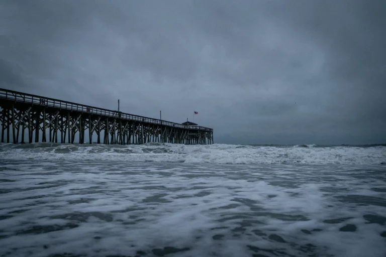 A pier in the sea during stormy weather